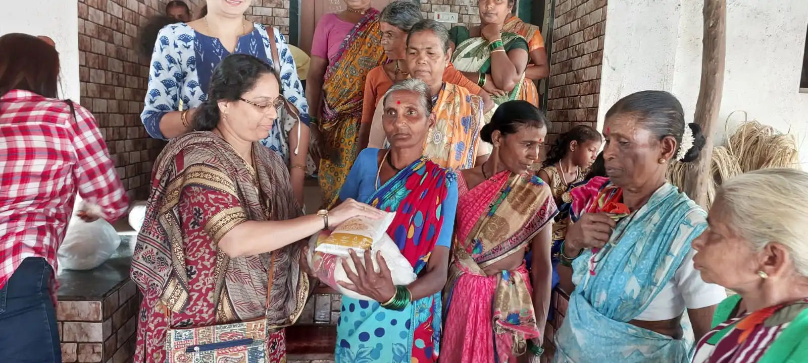 Groceries distribution. Adivasi needy Mahila